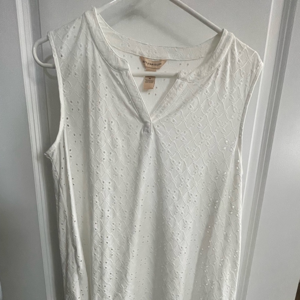 Sleeveless white blouse medium by Bit & Bridle. Has decorative holes all over